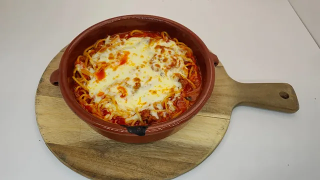 Chicken parmesan dinner with spaghetti and melted mozzarella