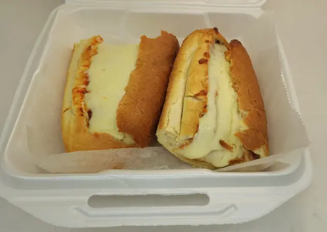 Toasted chicken parm subs with melted mozzarella