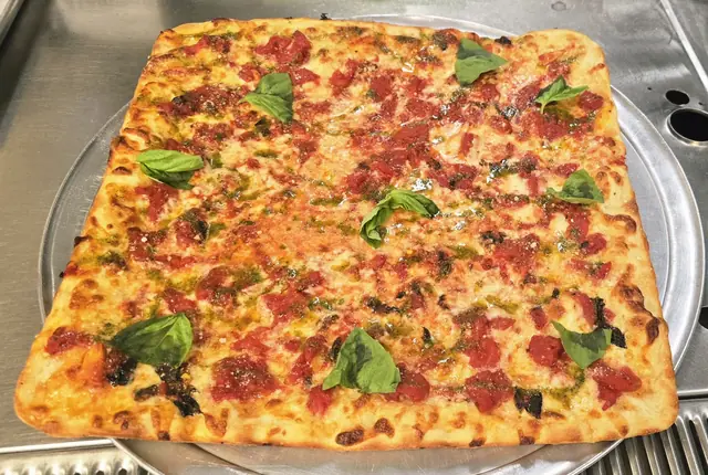 Square grandma pizza with basil