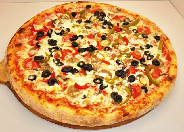 Italian veggie pizza with olives, peppers and mushrooms