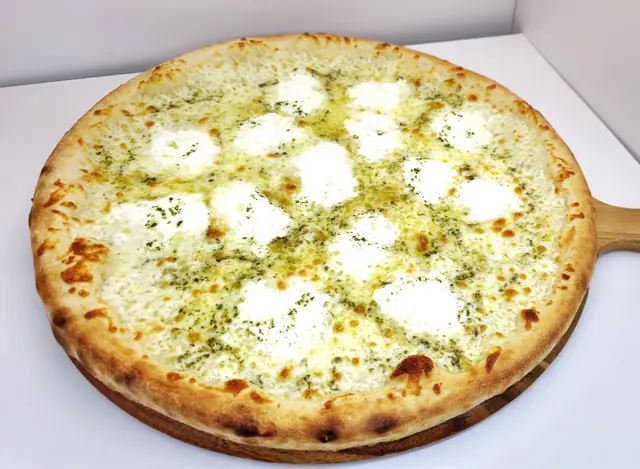 Pizza bianca with ricotta and herbs